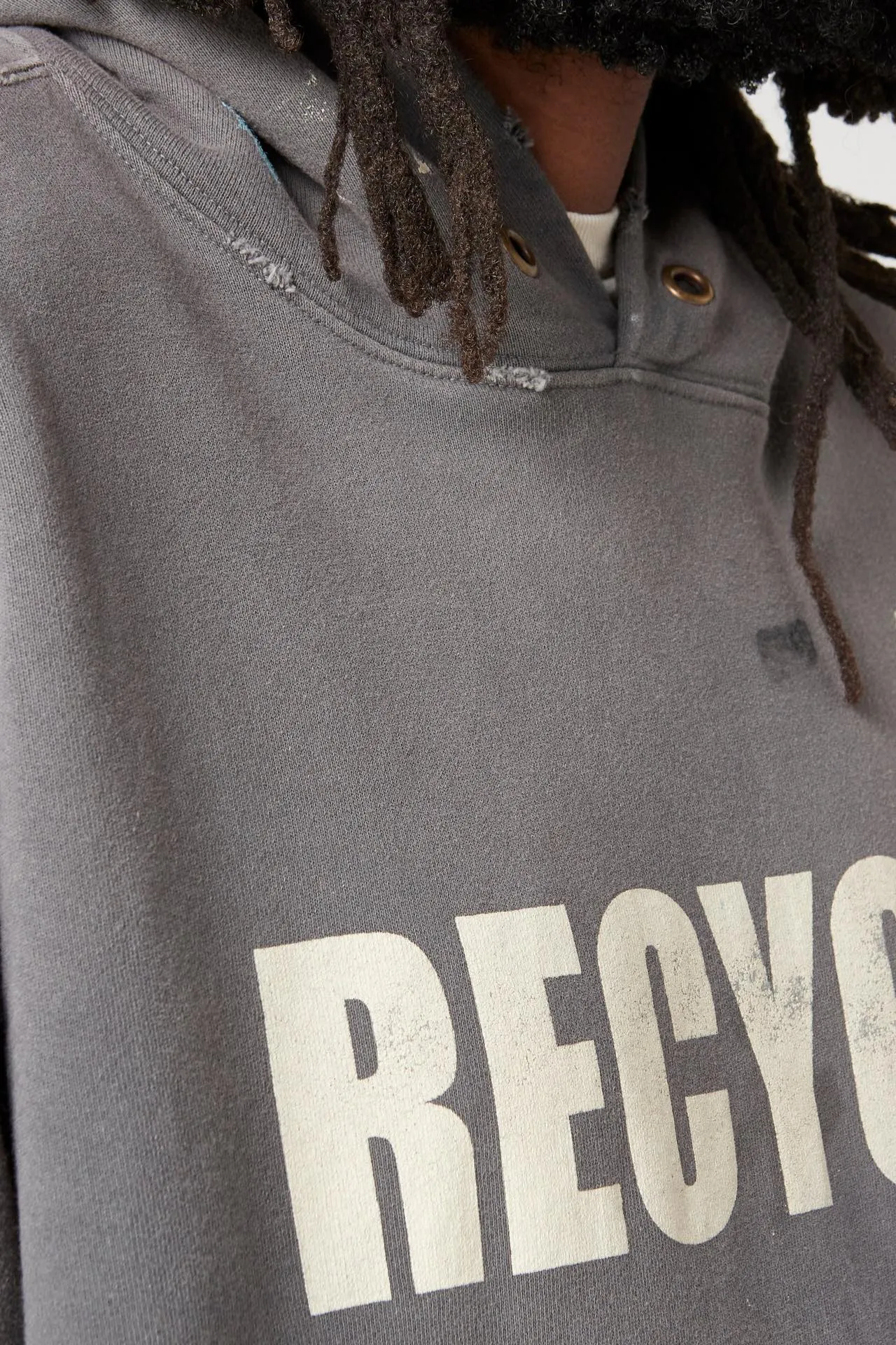 GALLERY DEPT. 90'S RECYCLE HOODIE WASHED BLACK 90'S washed hoodie with distressed eco-friendly slogans. Washed black S-XL. Ready-made garments are washed and dyed again. Multiple spots throughout the body are spray-faded. The ribs are cut and worn.